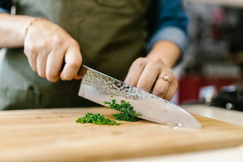 A chef's knife is one of the best basic kitchen essentials. Photo by RDNE Stock project.