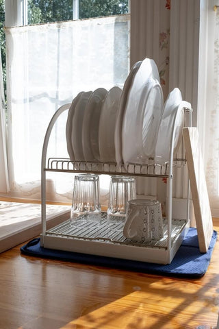 Dishes on a dish rack. Photo by Ron Lach.