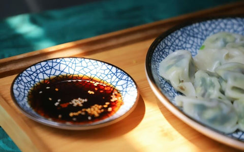 Pork and prawn dumplings with traditional dumpling dipping sauce. Photo by Cats Coming.