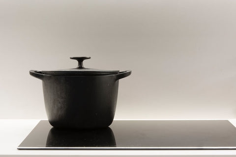 Cast iron Dutch oven on an induction cooktop. Photo by Alfonso Escu.