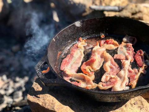 Lodge cast iron Dutch oven being cooked outdoors. Photo by Casey DeViese.