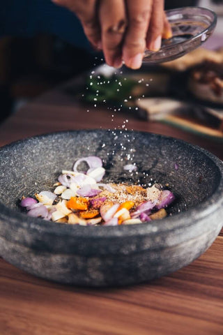 Example of a stone bowl for crushing and mixing Indian spices in an Indian kitchen.