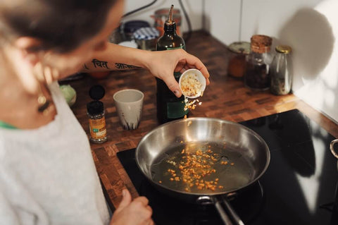 Stainless steel pans are great for tempering Indian spices. Photo by Conscious Design.