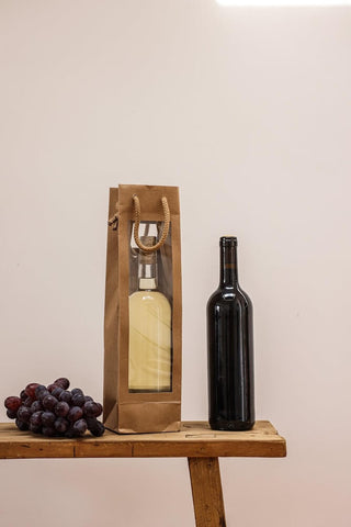 White wine and red wine bottles for gifting. Photo by Cup of Couple.