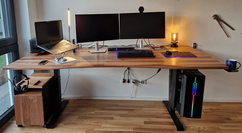 Figure 2: 220x100cm custom made walnut desk with extended cable management and a lot of additional add-ons.