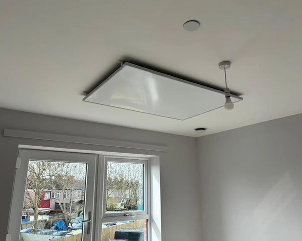 Ceiling mounted IR heating panel in living room