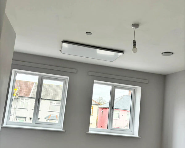 Ceiling mounted IR heating panel in bedroom