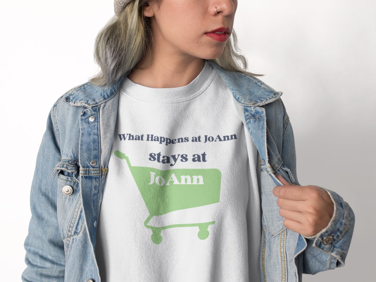 woman wearing a sweatshirt that says what happen at joanns stays at joann