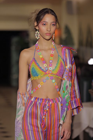 woman in colorful outfit with jewelries