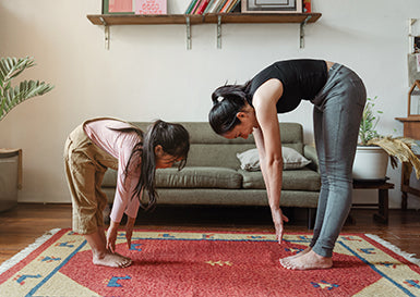 Photo of mom and daughter practicing yoga stretches by Ketut Subiyanto from Pexels