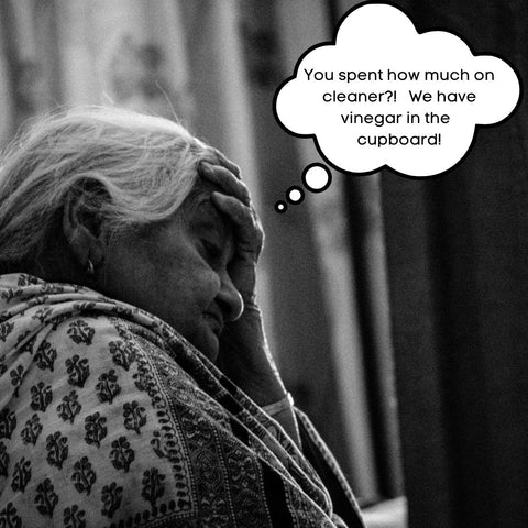 Photo of a grandmother with a thought bubble saying "You spent how much on cleaner? We have vinegar in the cupboard!"