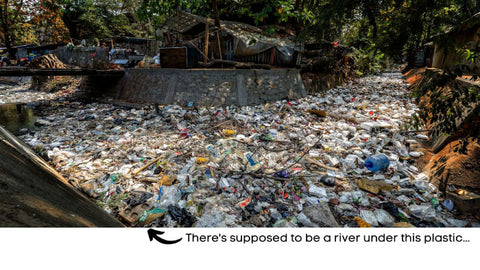 image of a river chocked in plastic in a developing country