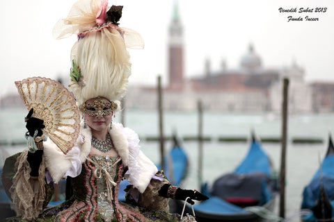 Image of a woman in costume and Venetian masque during the Venice Carnival, Italy