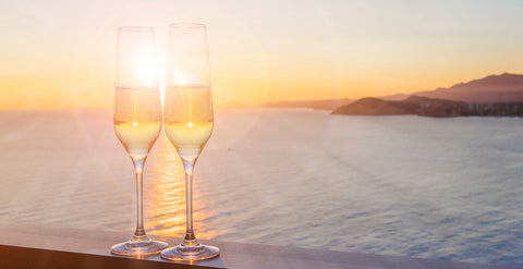 Sunset with sparkling drinks by the sea