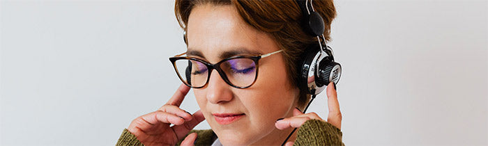 woman wearing headphones listening to self-hypnosis session