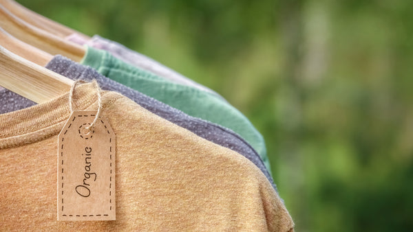 Sustainable t-shirts with a tag labelled as organic