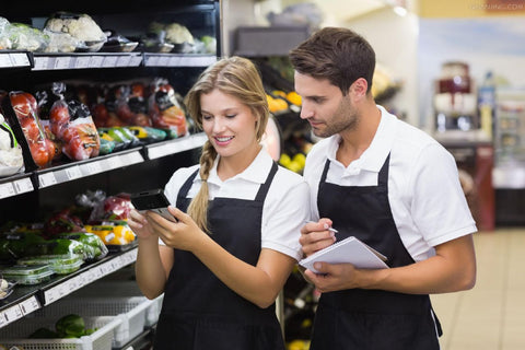 A man and a woman in apron