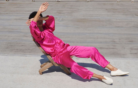 a woman covering her head while laying down