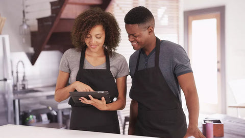 A man and woman in apron