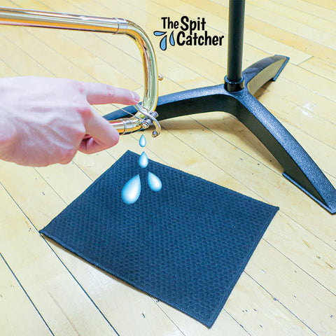 a floor mat for musicians' spit