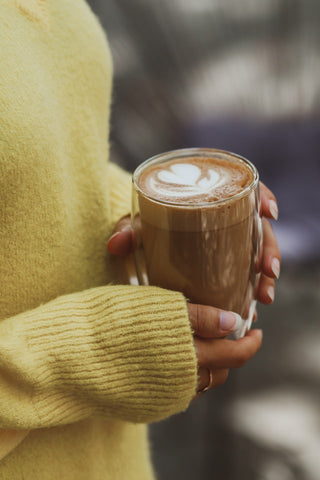 holding a coffee cup