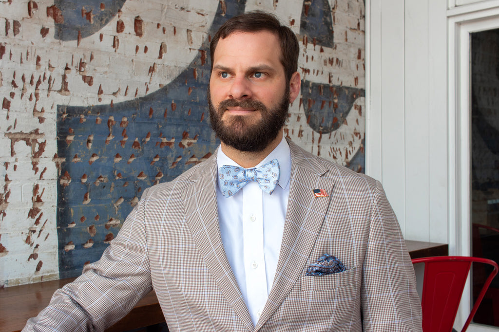 Man wearing suit and bow tie with beard