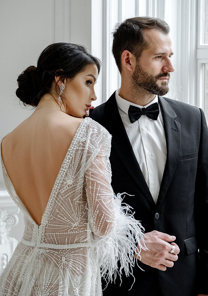 man and woman in black tie attire for festive formal occasion