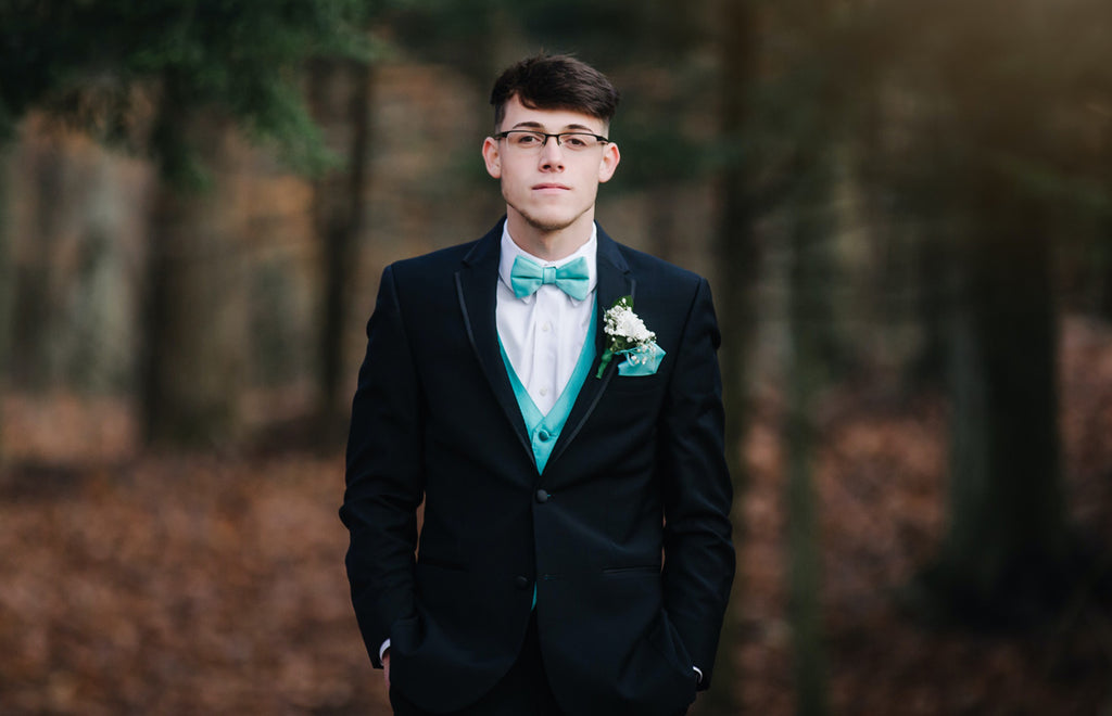 Young man with a well done bow tie color matching job