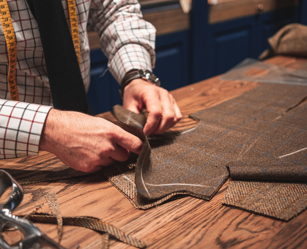 Tailor cutting a bespoke suit