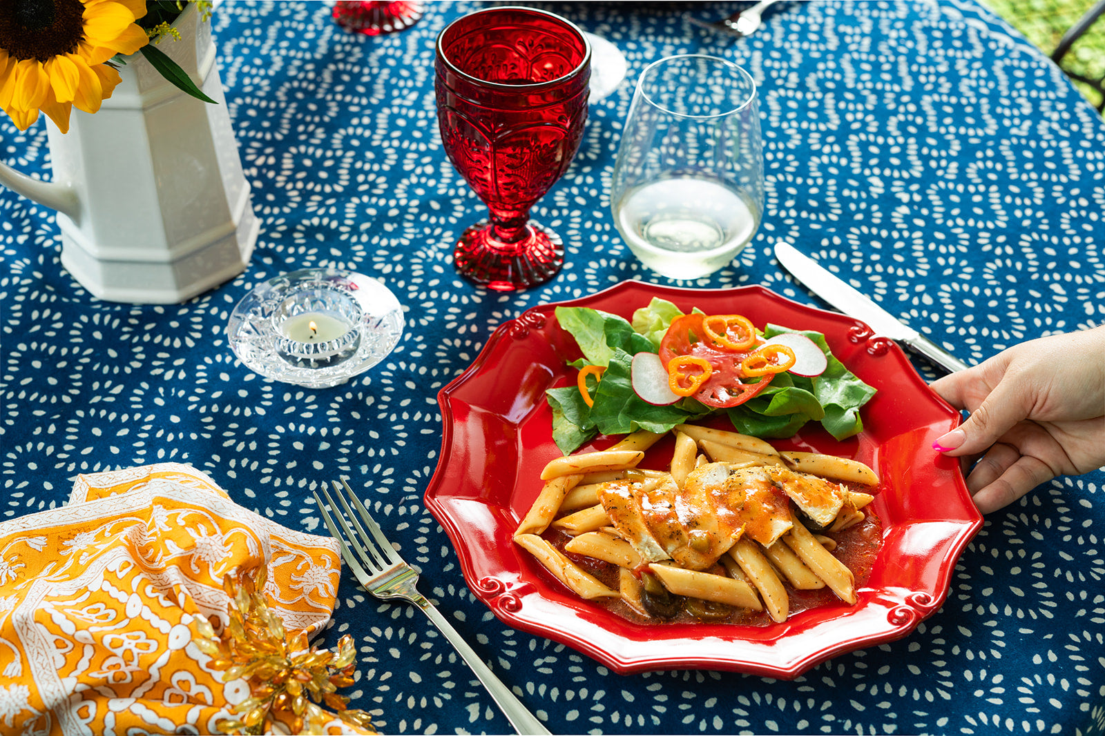 Simple meals like pasta with salad become special when you serve them outdoors.