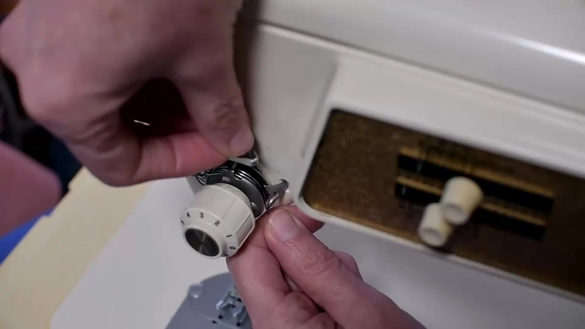 Thread positioned clockwise around the tension discs