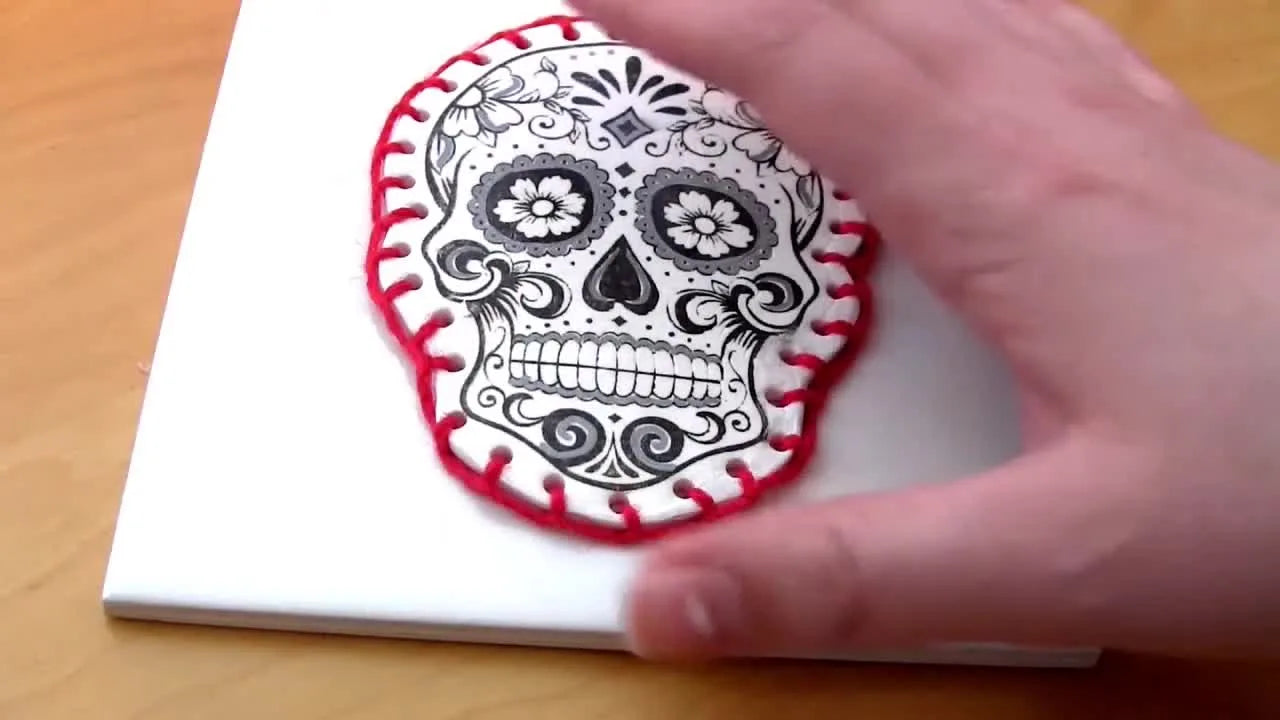 Finished embroidered clay ornament