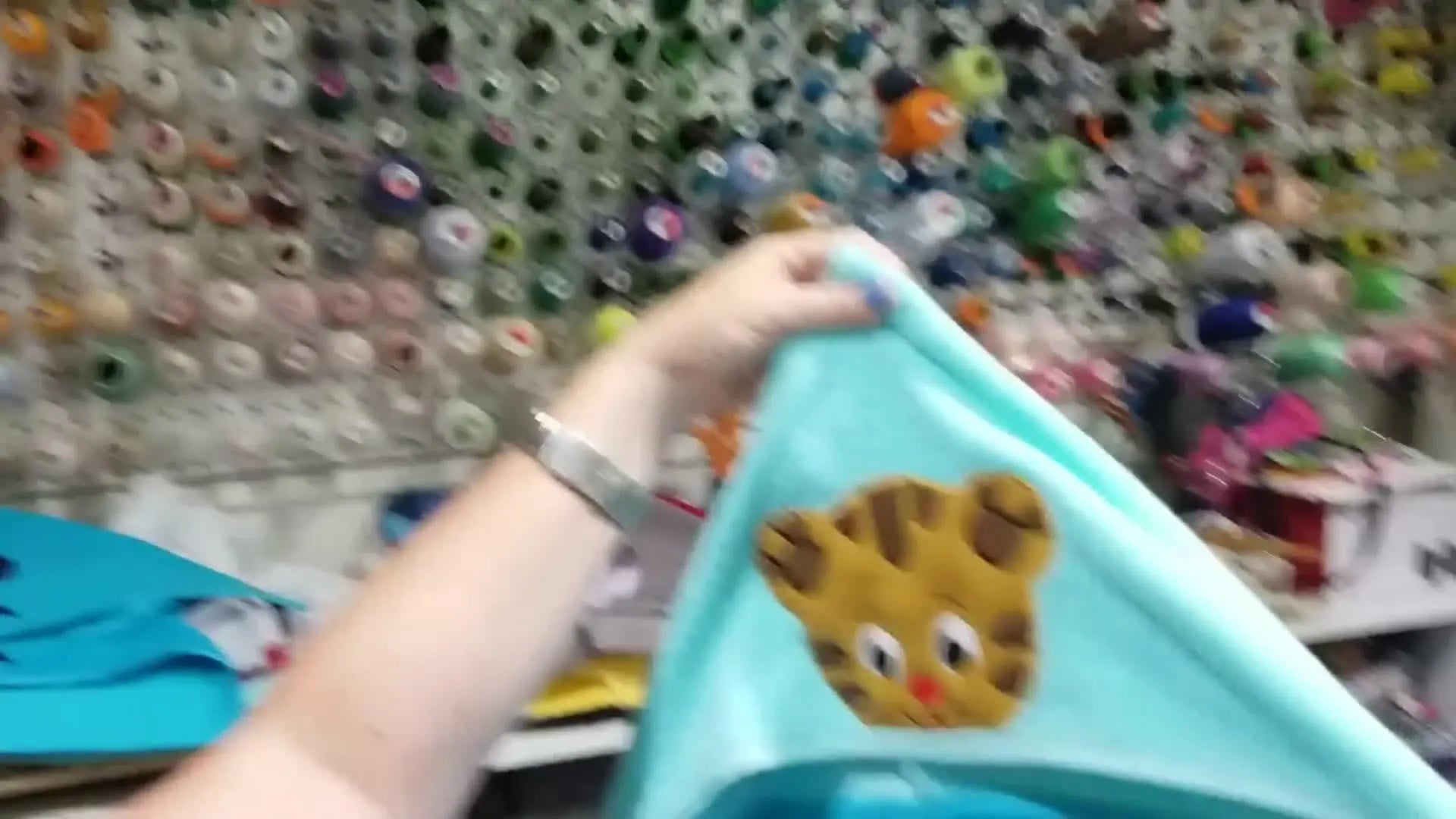 Completed blue hooded towel with embroidered tiger face