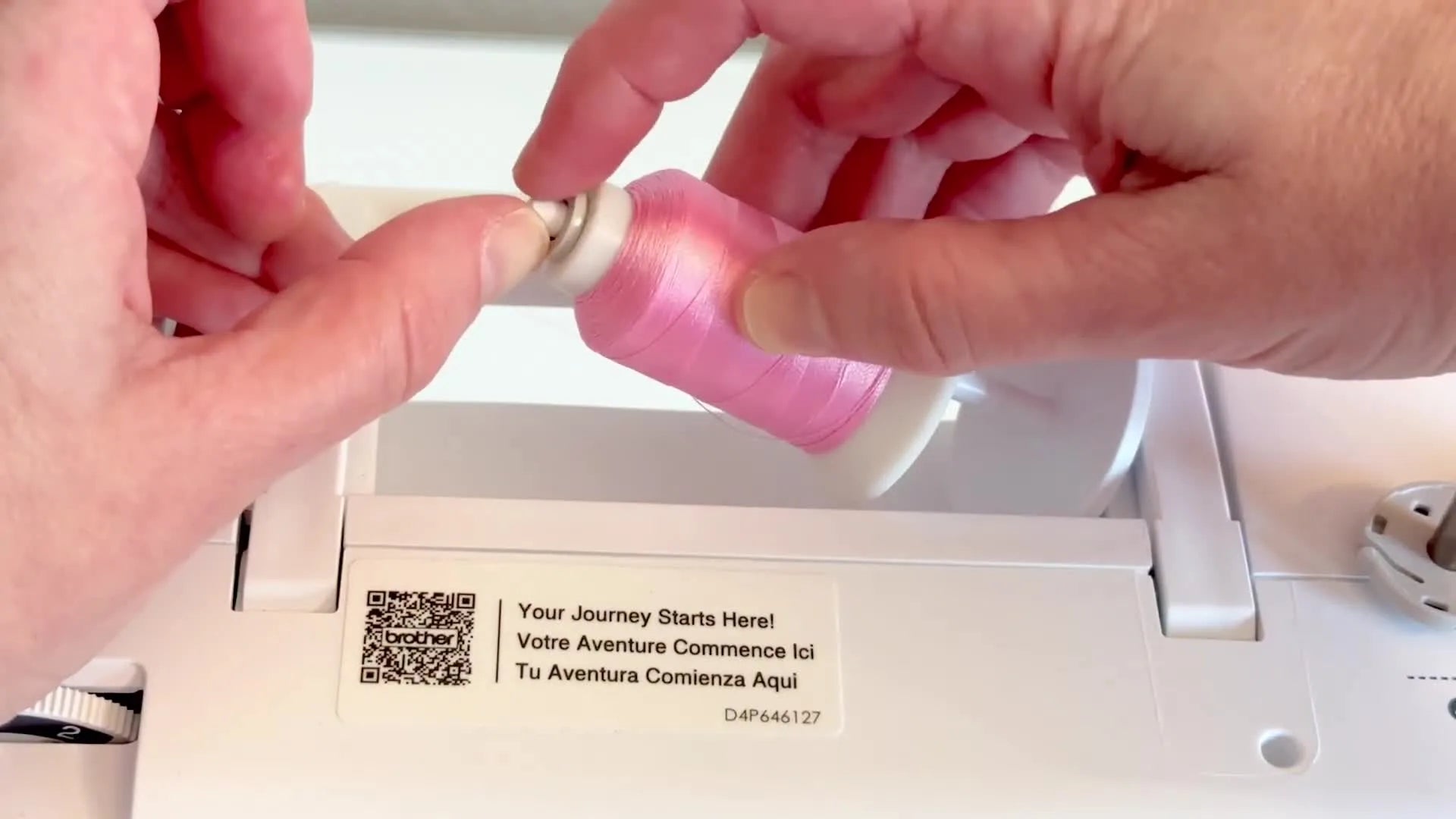 Properly assembled spool of pink thread with the correct end cap.