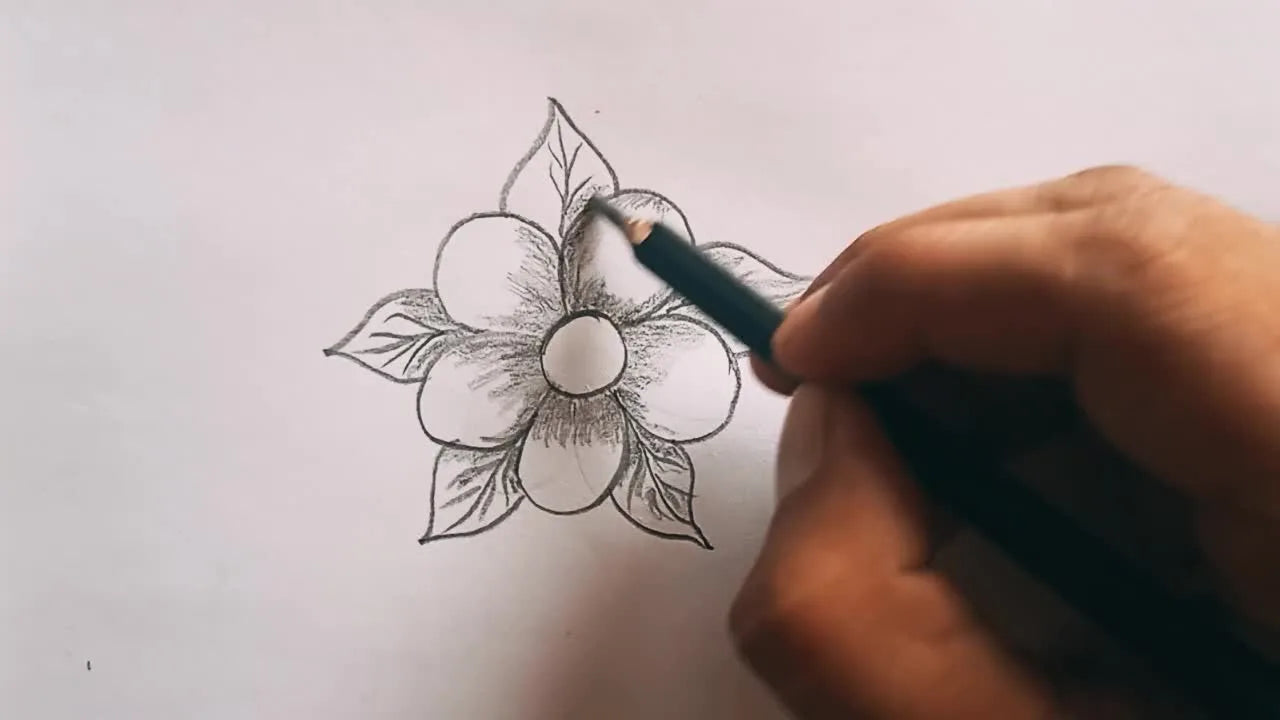 Hand shading a leaf, darker near the base and along the central vein.