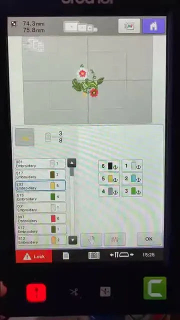 A leaf element in the embroidery design changes from green to yellow on the screen, reflecting a needle assignment change.