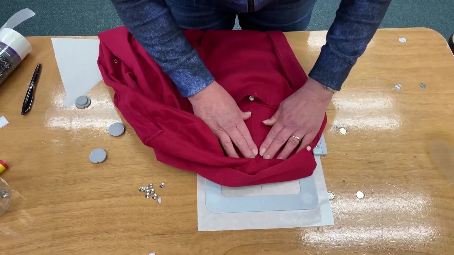 Garment smoothly hooped onto the sticky stabilizer.