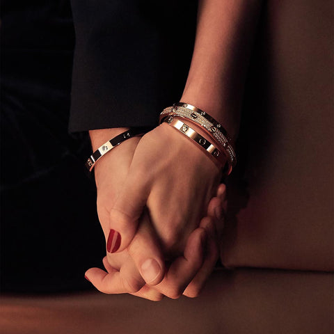 Cartier Love bracelets worn by two lovers