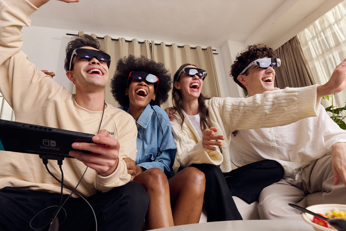 4 people using video viewing glasses to play games