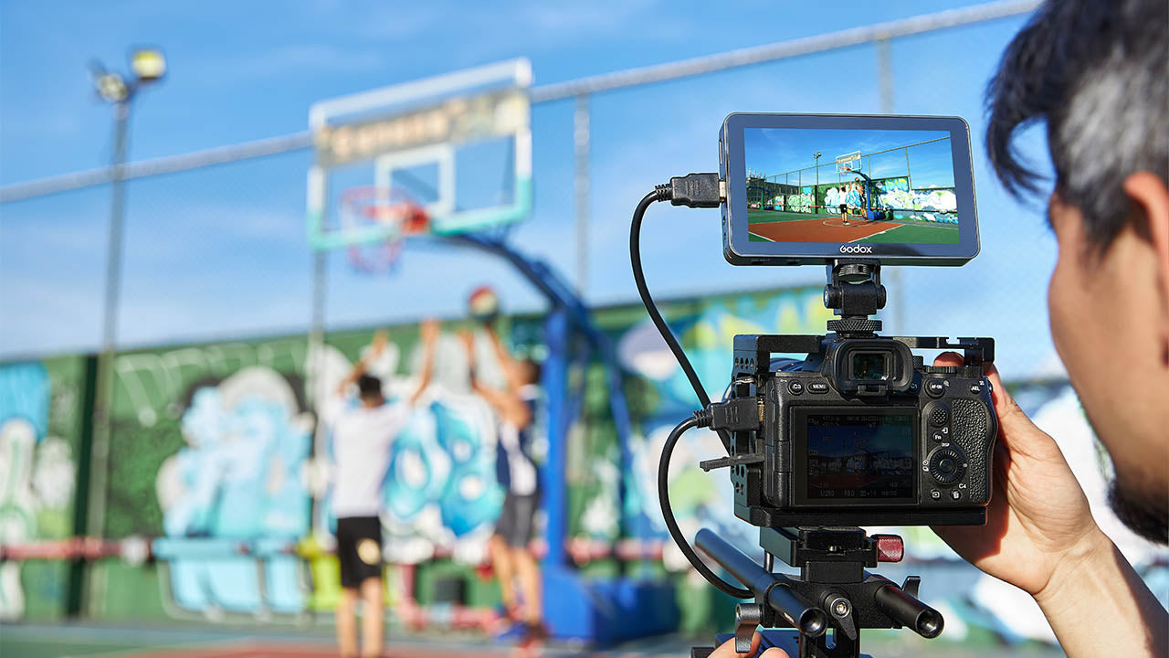 Godox GM6S being used to film a Basketball game outdoors in the sun