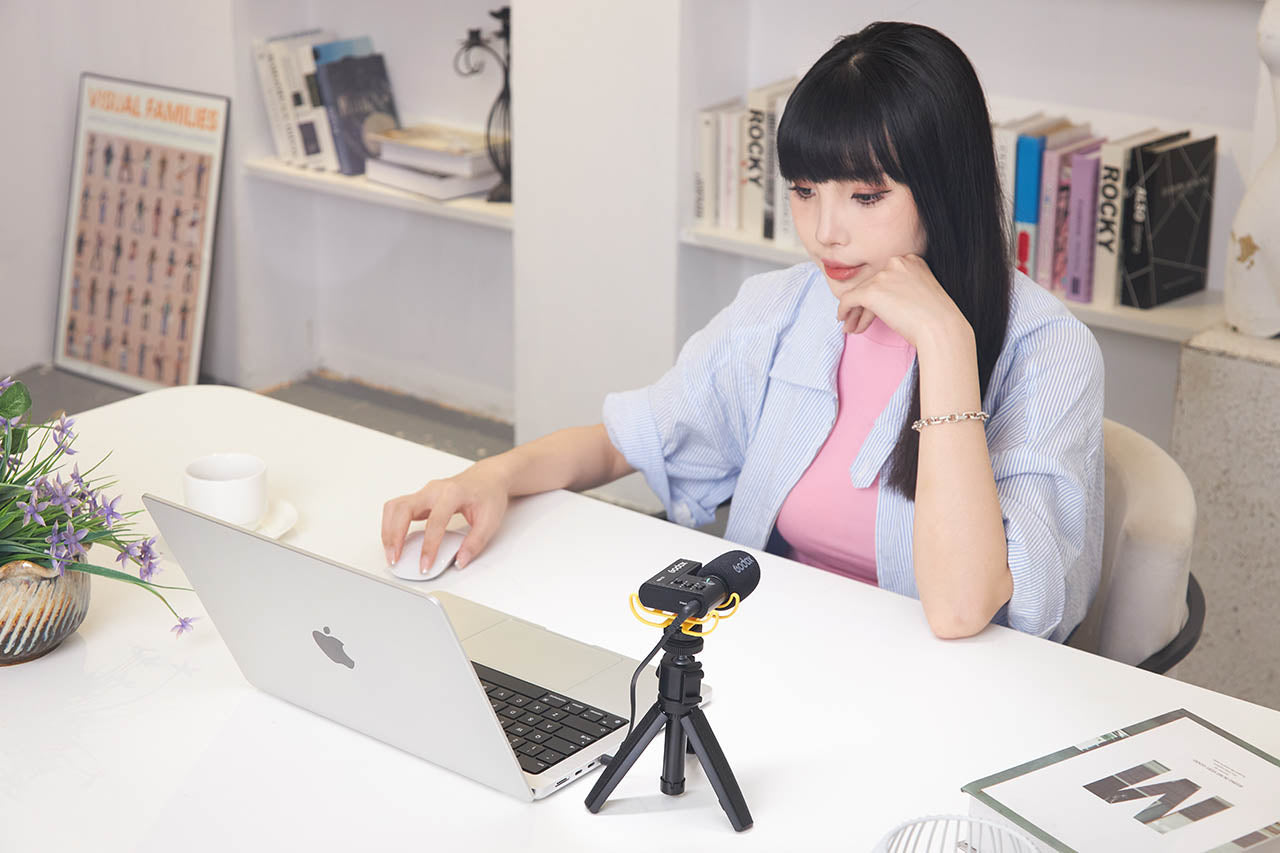 The GODOX IVM-S2 Microphone being used with a laptop computer