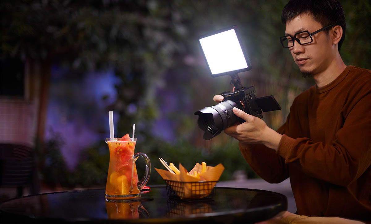 A Godox LDP-Series LED Light Panel being used to illuminate food by a photographer