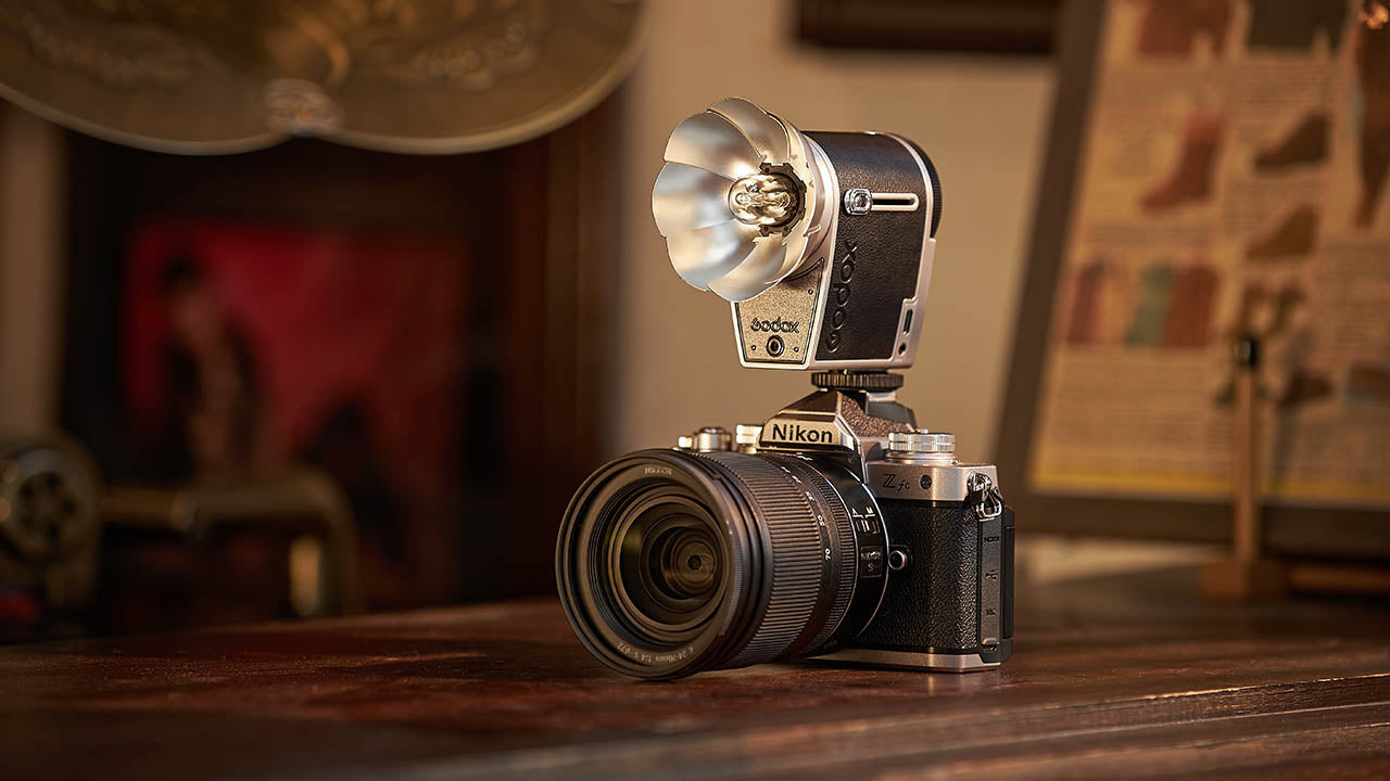 GODOX Lux Cadet Flash Mounted to a camera in a vintage-styled interior