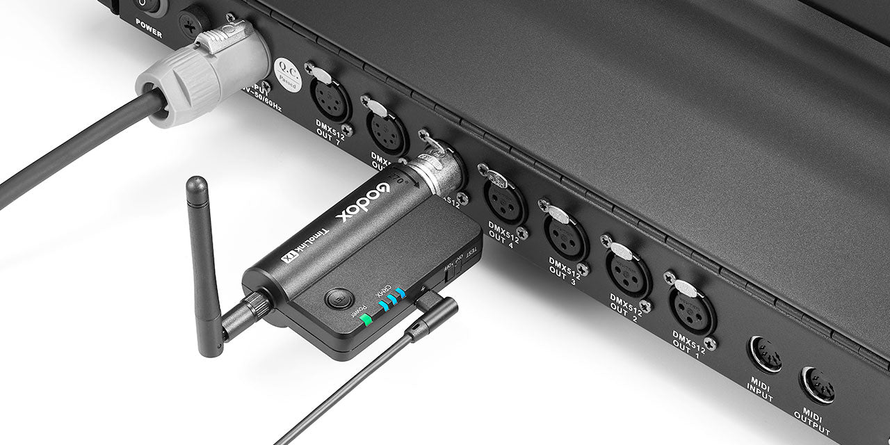 TimoLink TX Wireless DMX Transmitter plugged into a DMX Console