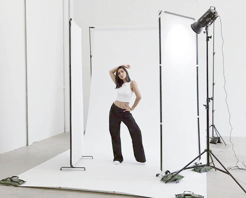 Free-Standing Reflector Panels being used on a photoshoot with model