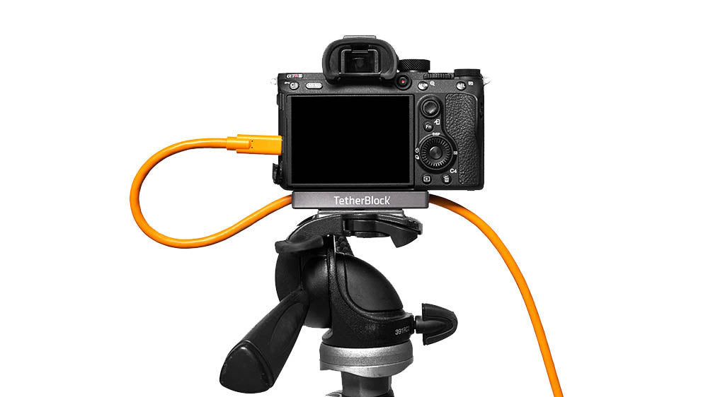 Tether Tools CUC3215-ORG cable plugged into the side of a camera