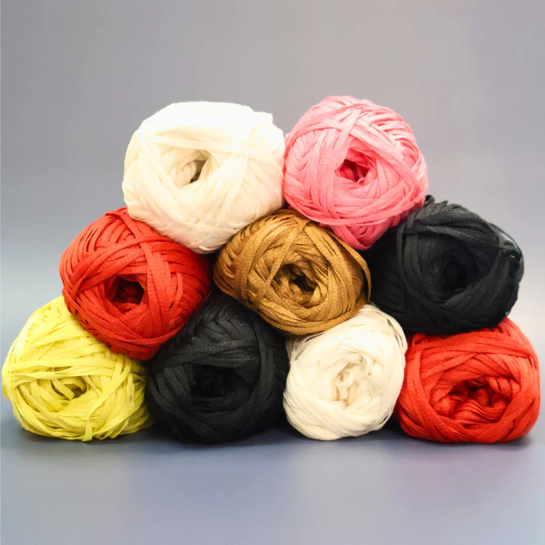 lots of our polyester tape yarns stacked in a pile thats very colorful