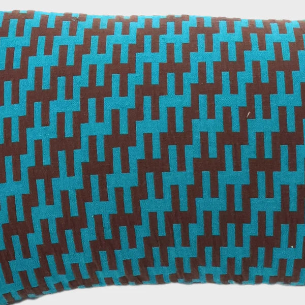 close up of our blue and brown geometric pattered throw pillow