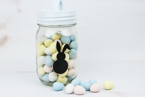 pint mason jar full of mini eggs with small Easter bunny decal on it