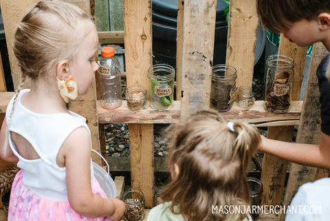 three kids selecting diy potions ingredients to make their own potions at a Harry Potter birthday party